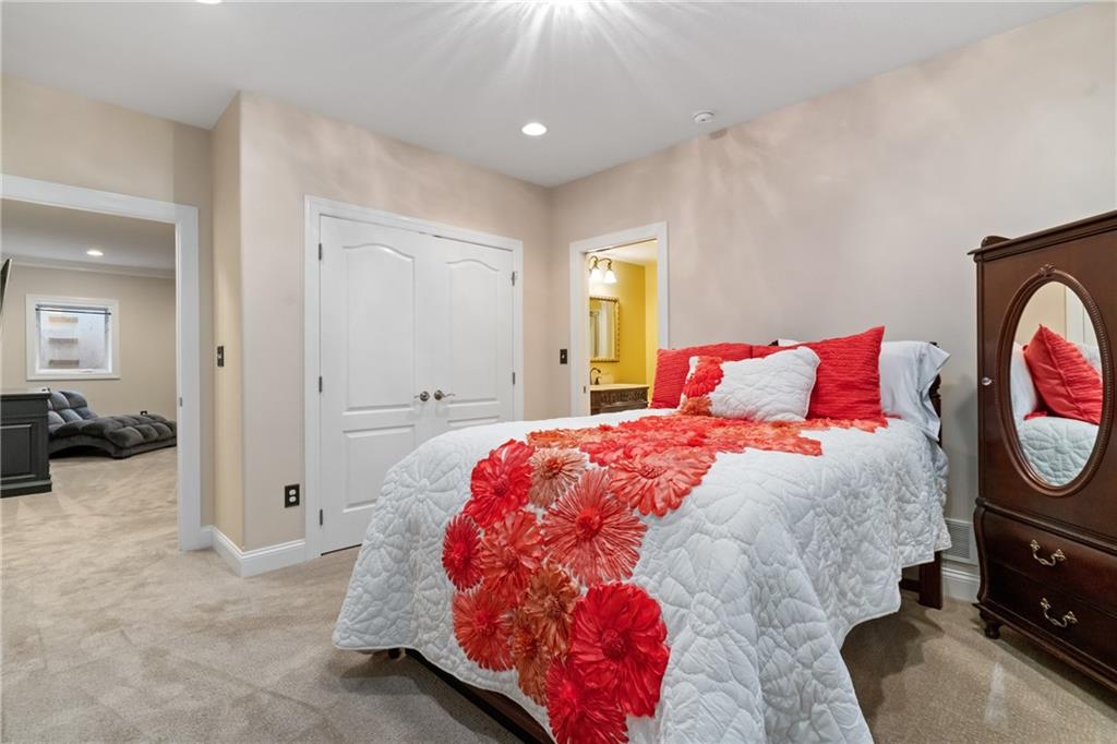 1737 Waterleaf Drive Sewickley, PA 15143 - Photo 27 of 34 a bedroom with a bed and wooden floor