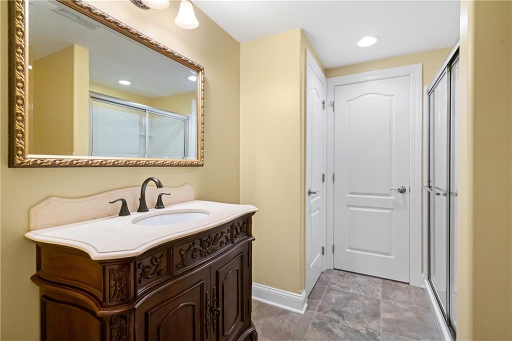 1737 Waterleaf Drive Sewickley, PA 15143 - Photo 28 of 34 a bathroom with a sink and a mirror
