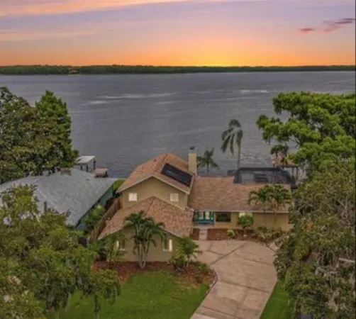 a view of a houses with an outdoor space and lakeside