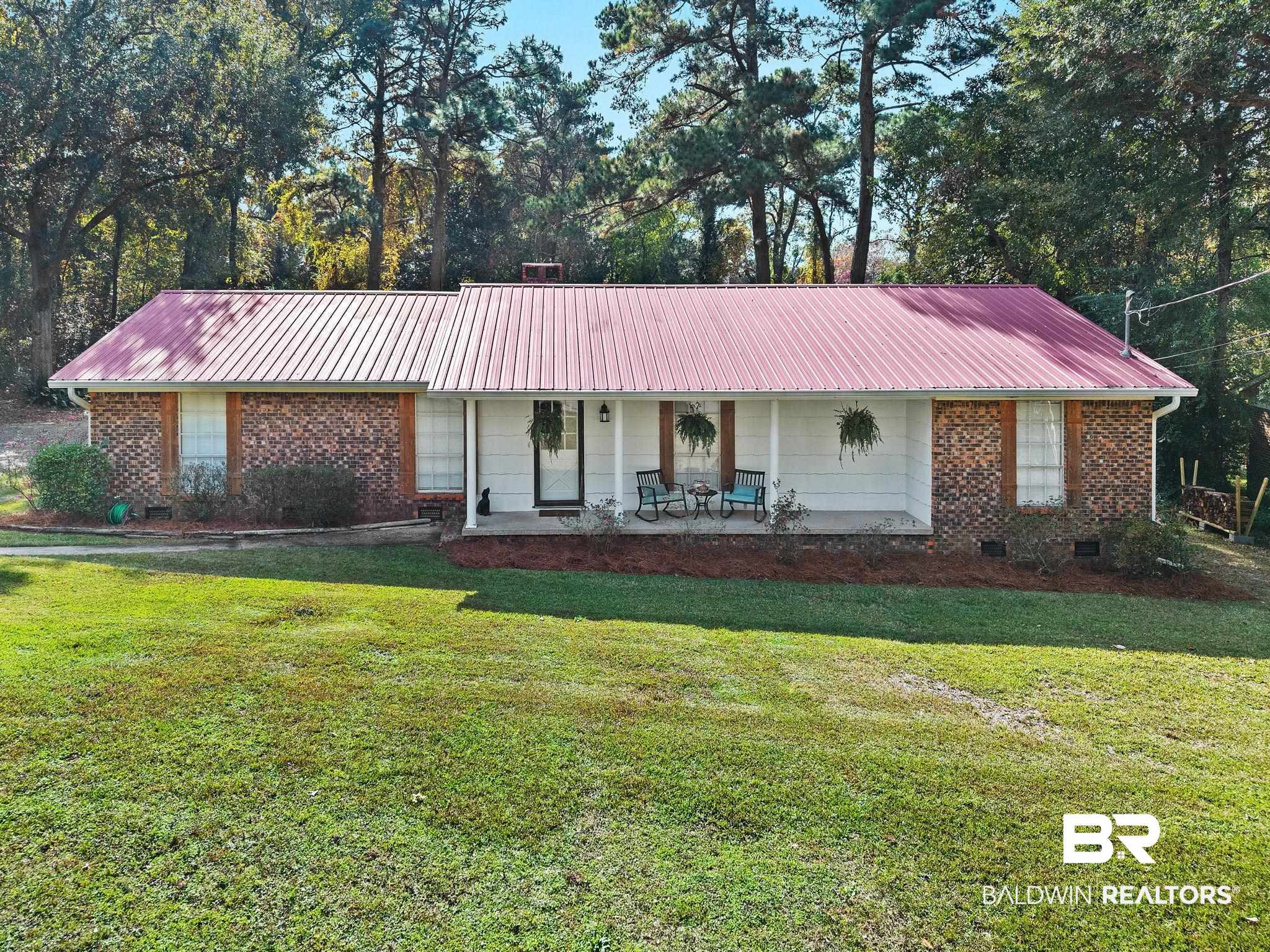 4 Rally Road Spanish Fort, AL 36527 - Photo 1 of 41 Single story home with a metal roof, a front yard, and brick siding