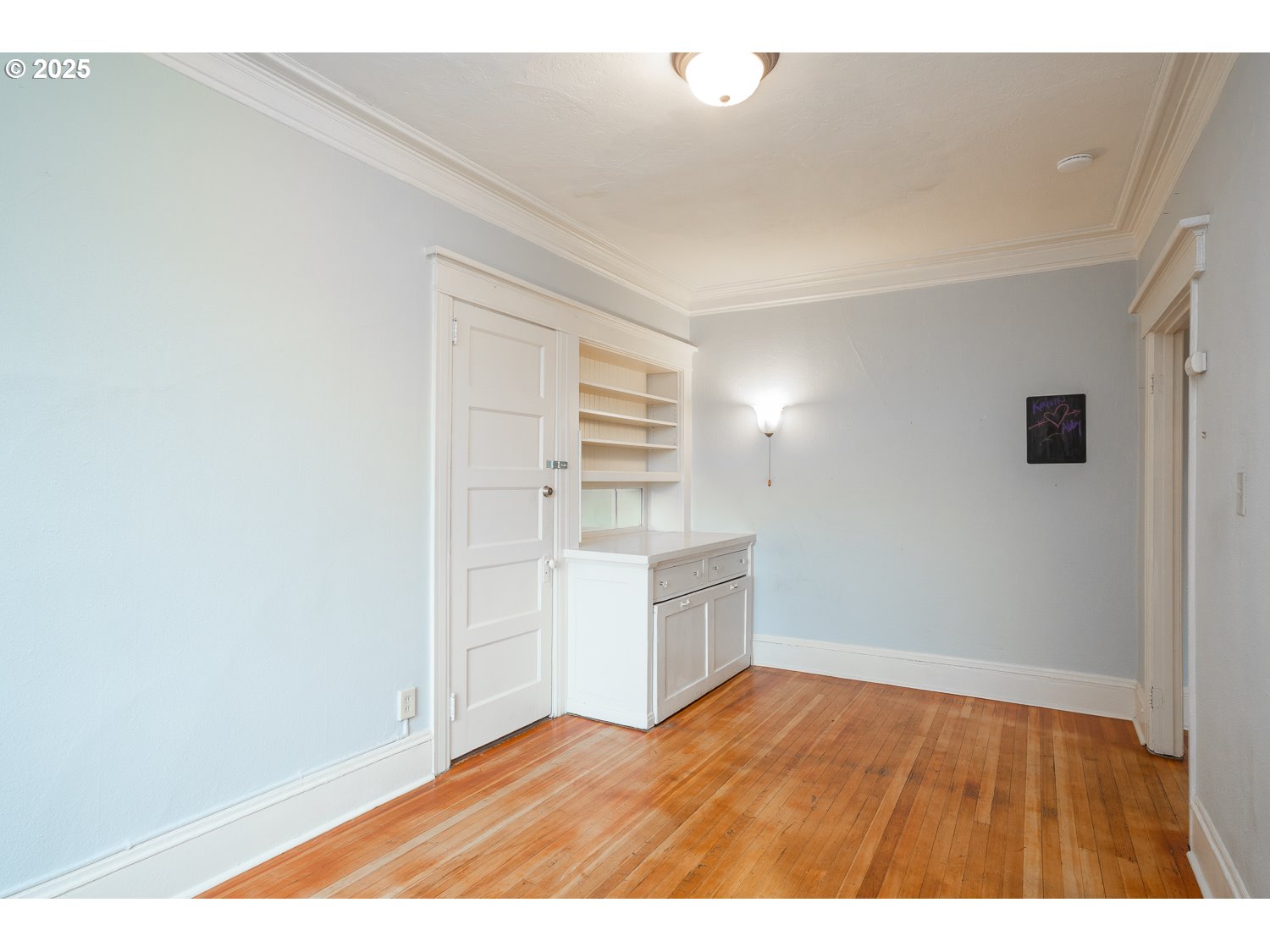 2109 Northwest Irving Street, Unit 407 Portland, OR 97210 - Photo 15 of 17 a view of empty room with wooden floor