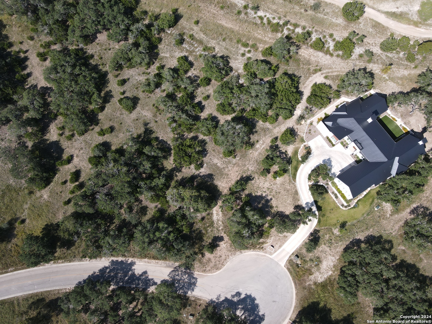 13 Winged Foot Boerne, TX 78006 - Photo 4 of 6 an aerial view of a house with a yard