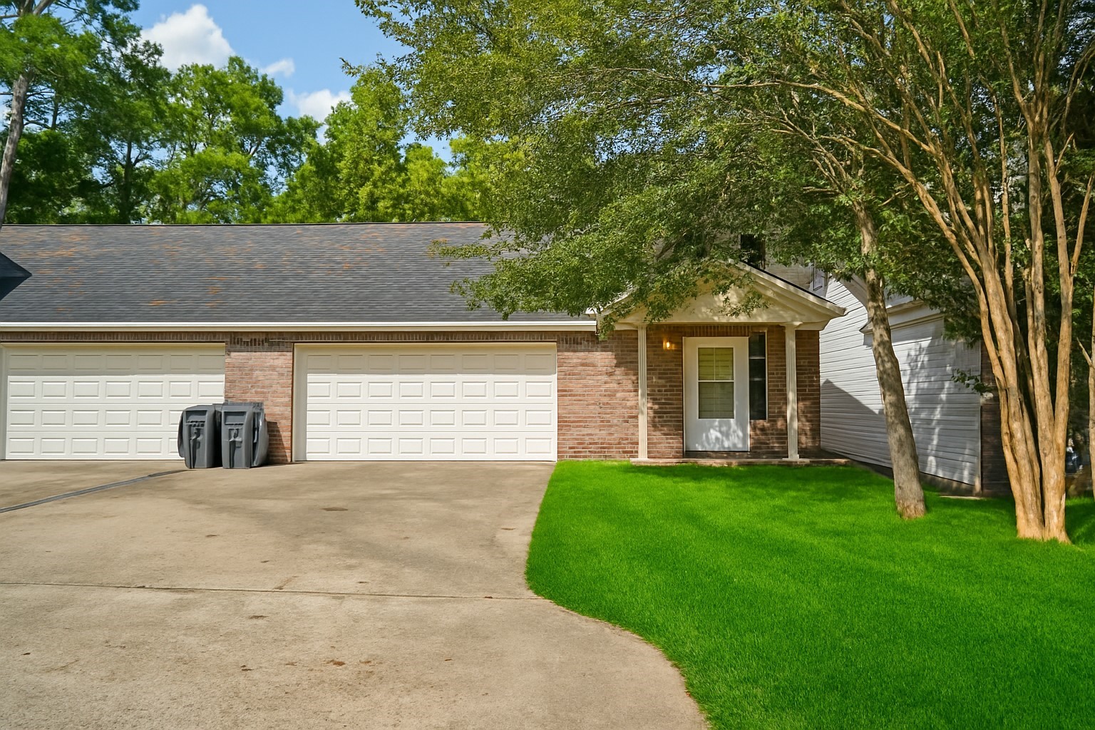 100 Westpark Drive, Unit 5 Conroe, TX 77304 - Photo 1 of 23 a view of a house with a yard and tree