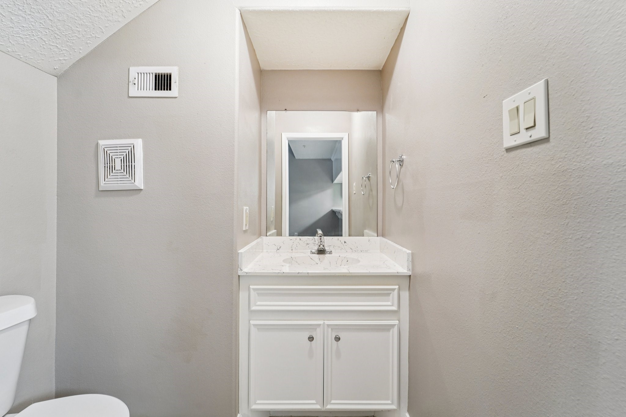 100 Westpark Drive, Unit 5 Conroe, TX 77304 - Photo 11 of 23 a bathroom with a sink toilet and mirror