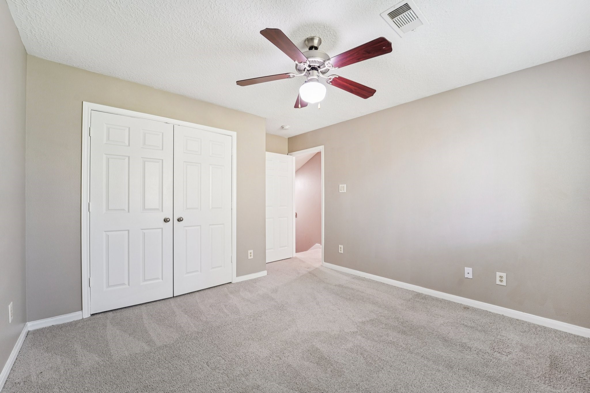 100 Westpark Drive, Unit 5 Conroe, TX 77304 - Photo 14 of 23 an empty room with ceiling fan and a ceiling fan