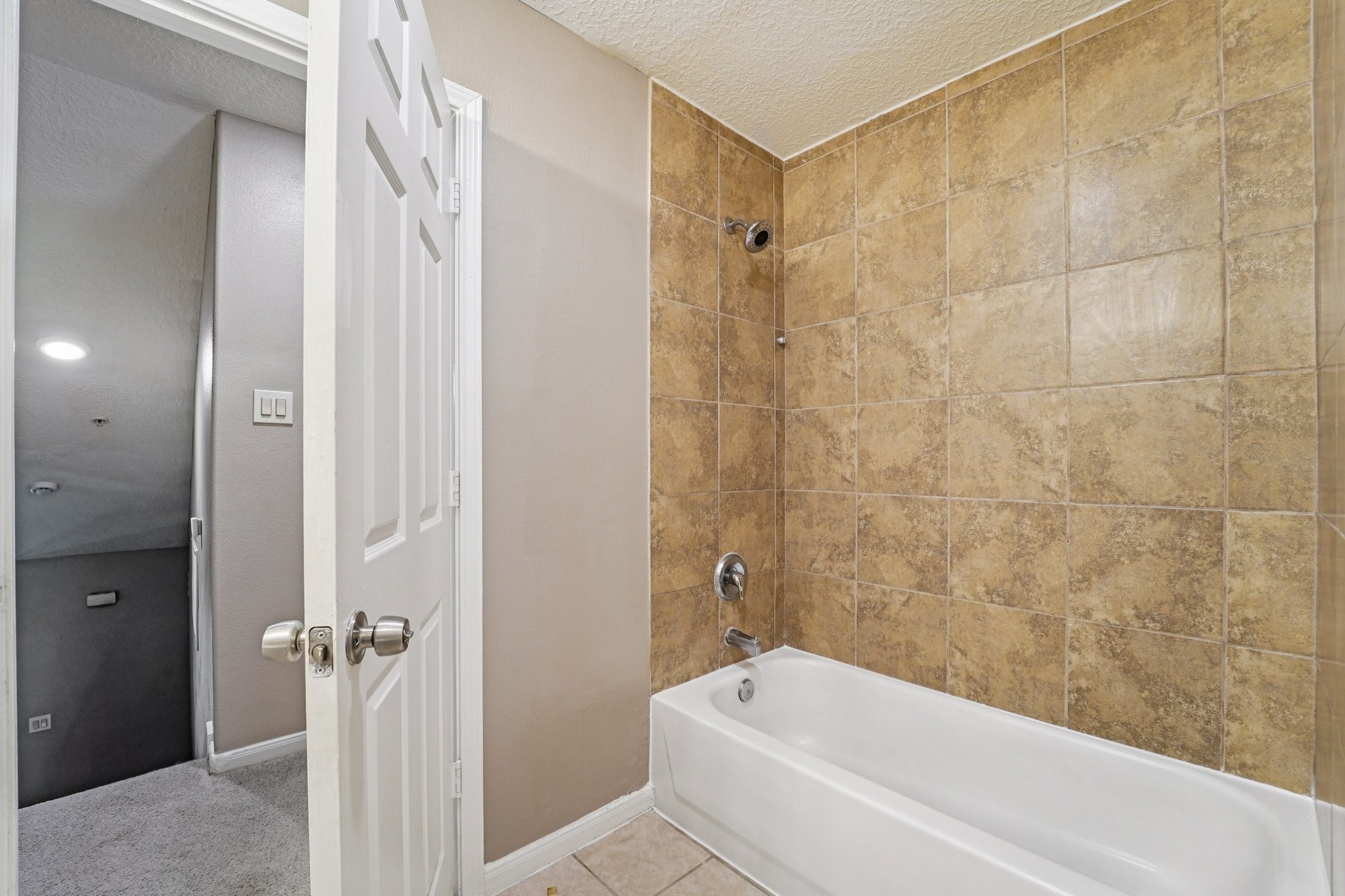 100 Westpark Drive, Unit 5 Conroe, TX 77304 - Photo 16 of 23 a bathroom with a bathtub and a shower