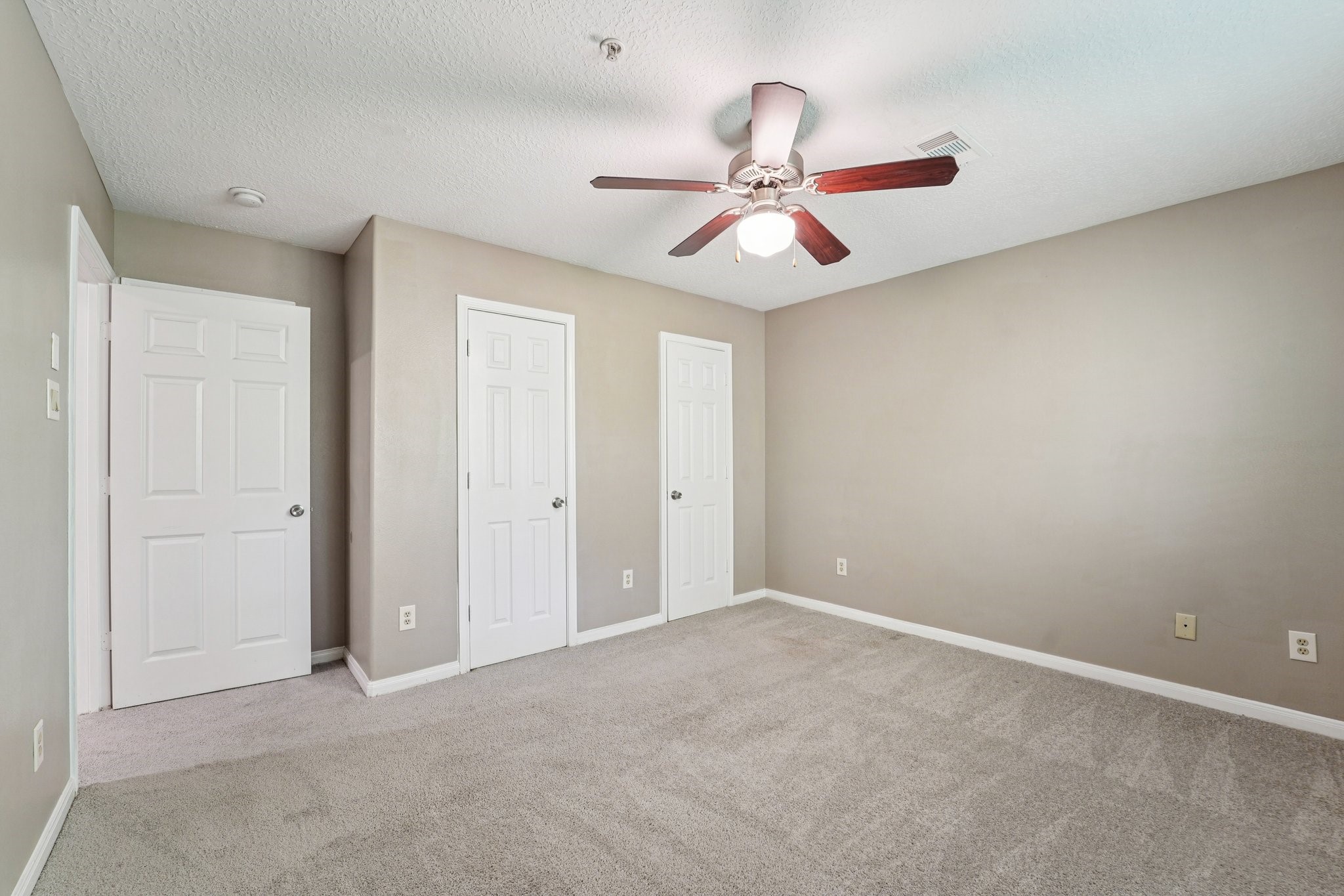 100 Westpark Drive, Unit 5 Conroe, TX 77304 - Photo 19 of 23 an empty room with windows and fan