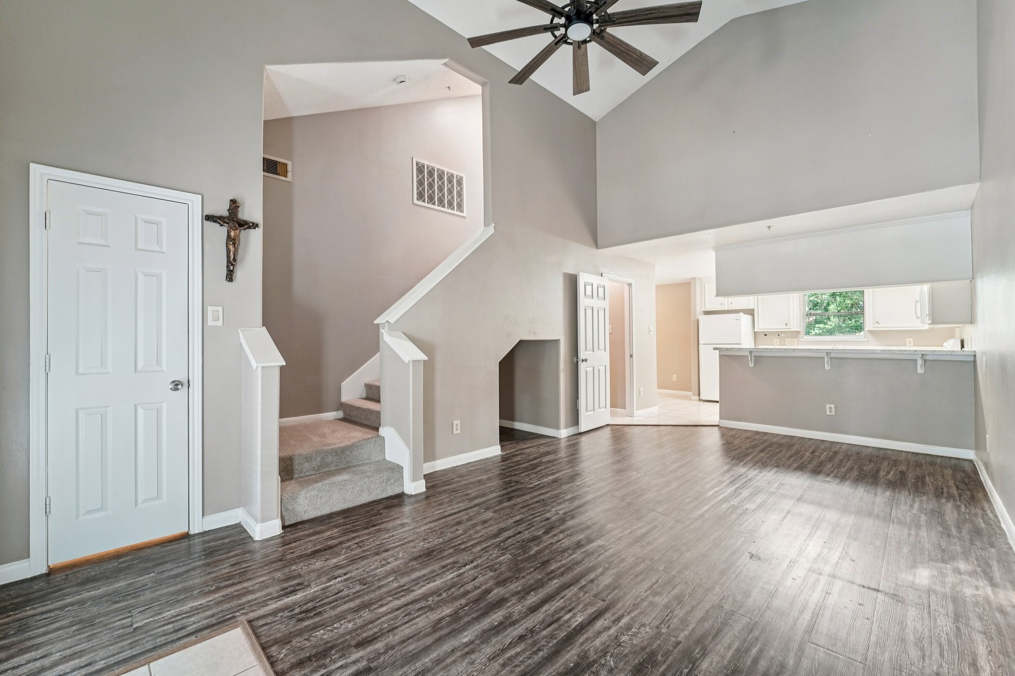 100 Westpark Drive, Unit 5 Conroe, TX 77304 - Photo 3 of 23 a view of empty room with wooden floor and ceiling fan