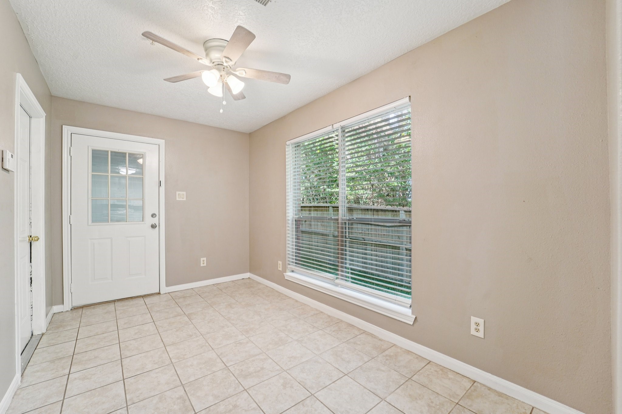 100 Westpark Drive, Unit 5 Conroe, TX 77304 - Photo 10 of 23 a view of an empty room with a window