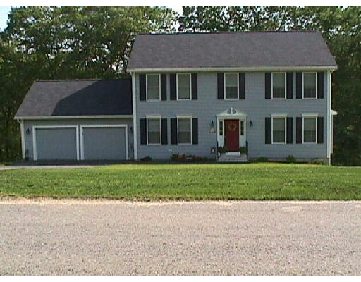 91 Autumn Road Dracut, MA 01826 - Photo 1 of 1 a front view of a house with a garden and yard