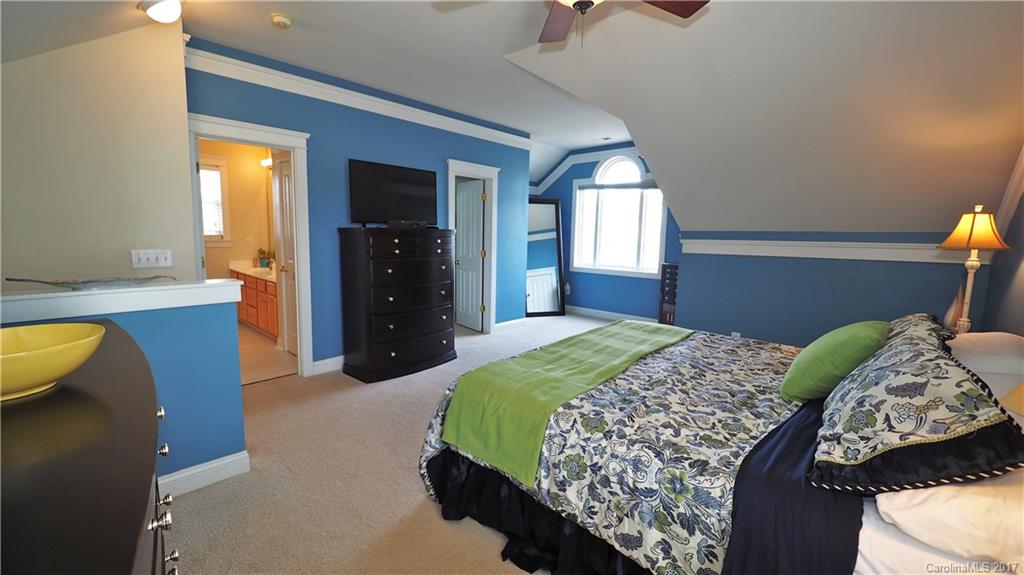 8106 Strandhill Road, Unit 12 Huntersville, NC 28078 - Photo 14 of 24 a bedroom with bed and window