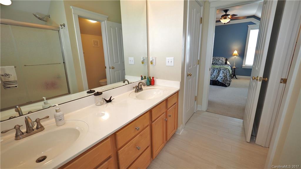 8106 Strandhill Road, Unit 12 Huntersville, NC 28078 - Photo 15 of 24 a en suite bathroom with double sink and mirror