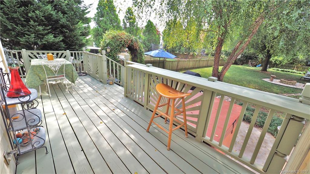 8106 Strandhill Road, Unit 12 Huntersville, NC 28078 - Photo 16 of 24 a balcony with wooden floor and outdoor seating