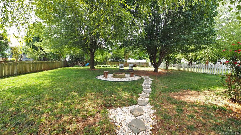 8106 Strandhill Road, Unit 12 Huntersville, NC 28078 - Photo 19 of 24 a view of a backyard with a garden