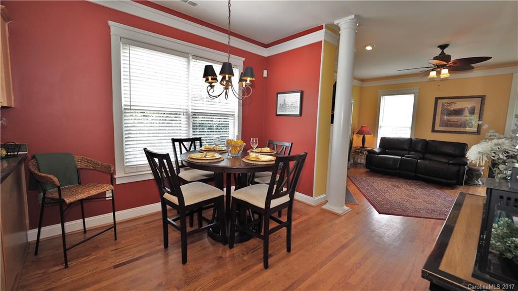 8106 Strandhill Road, Unit 12 Huntersville, NC 28078 - Photo 7 of 24 a view of a dining room with furniture window and wooden floor