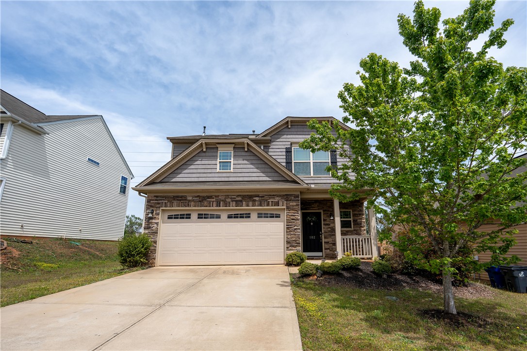 102 Talisker Way Greenville, SC 29607 - Photo 1 of 18 This charming home features a mix of siding and stone, with a welcoming porch and attached garage.