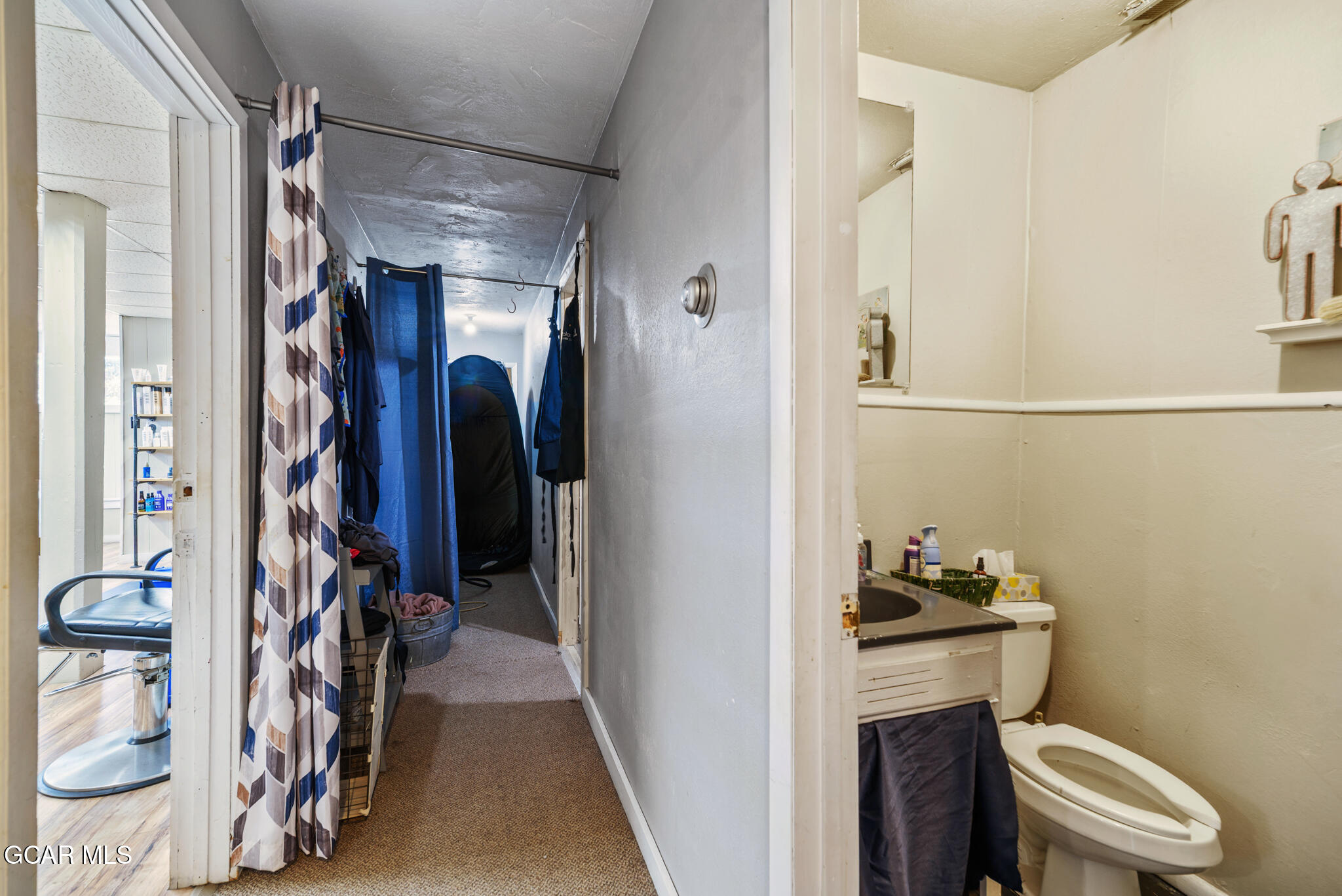 104 3rd Street Kremmling, CO 80459 - Photo 14 of 71 a view of walk in closet with clothes and shoes