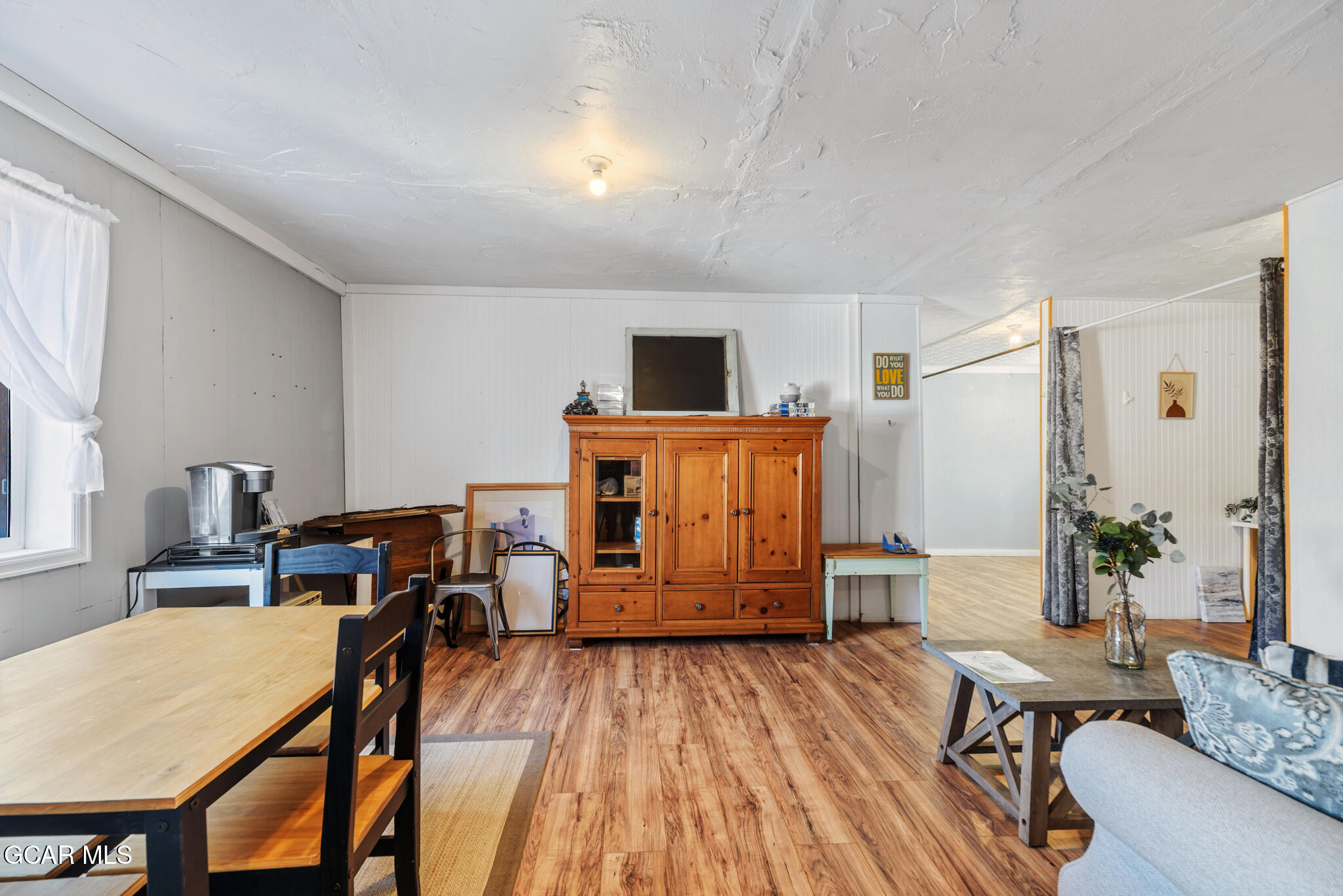 104 3rd Street Kremmling, CO 80459 - Photo 17 of 71 a living room with furniture and a wooden floor