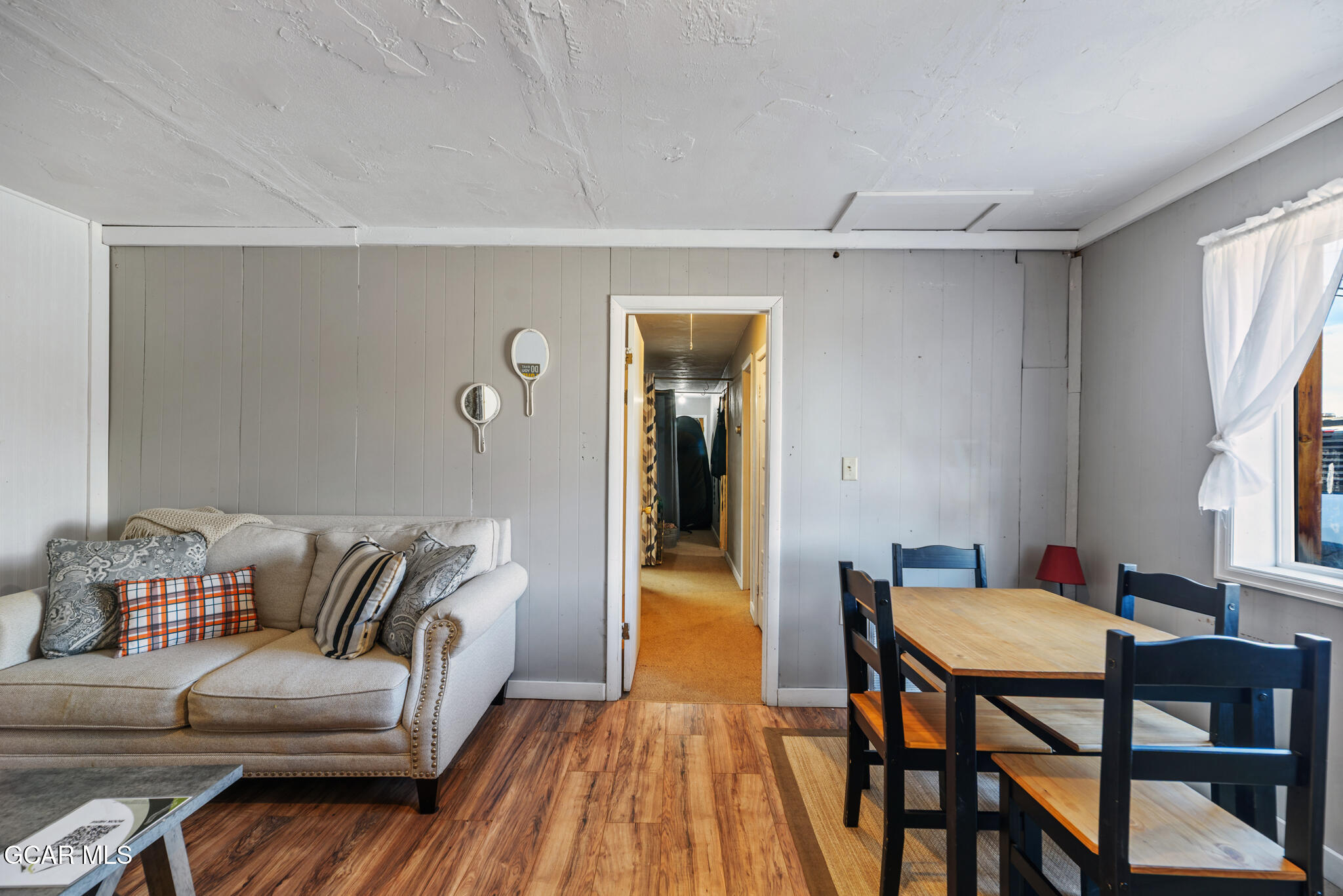 104 3rd Street Kremmling, CO 80459 - Photo 19 of 71 a living room with furniture and a wooden floor