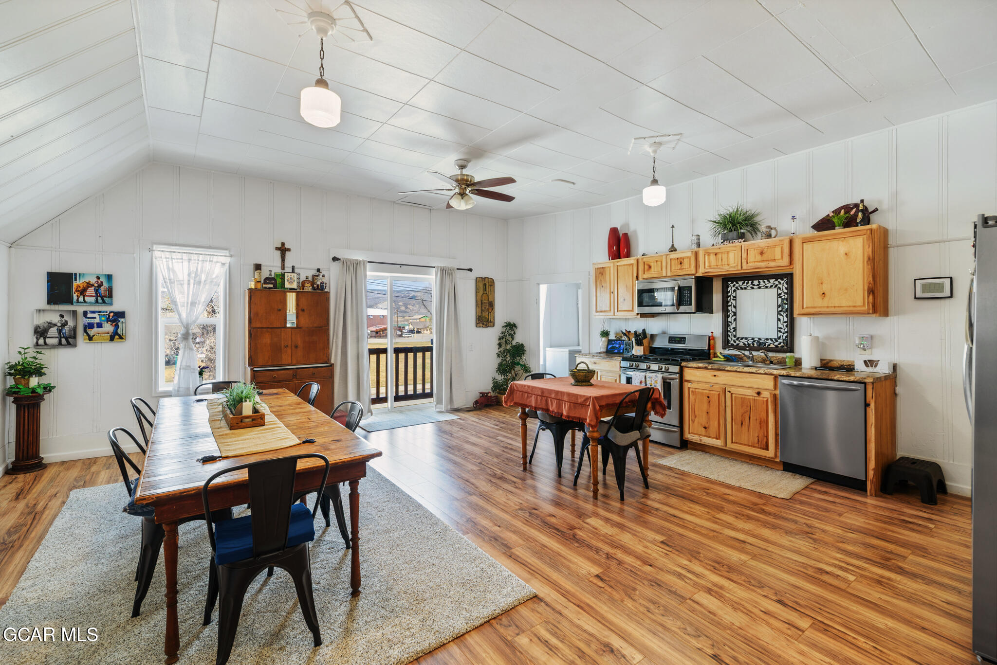 104 3rd Street Kremmling, CO 80459 - Photo 40 of 71 a living room with furniture kitchen view and a wooden floor