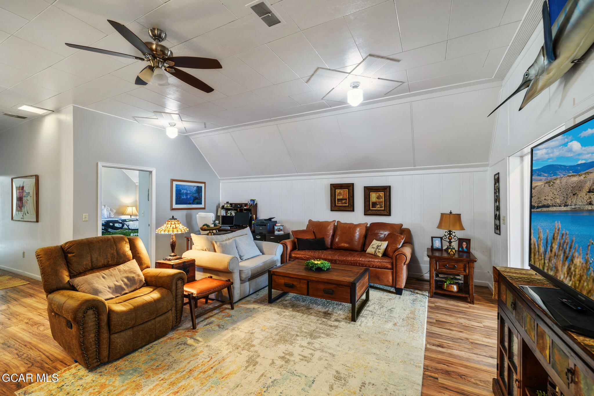 104 3rd Street Kremmling, CO 80459 - Photo 48 of 71 a living room with furniture and a flat screen tv