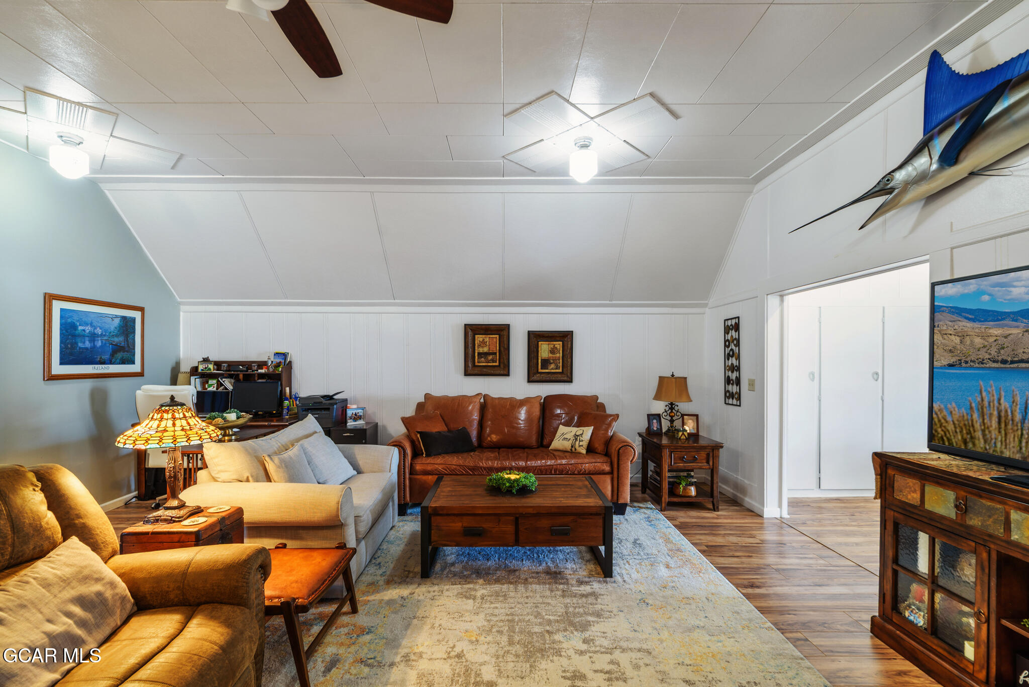104 3rd Street Kremmling, CO 80459 - Photo 49 of 71 a living room with furniture and a flat screen tv