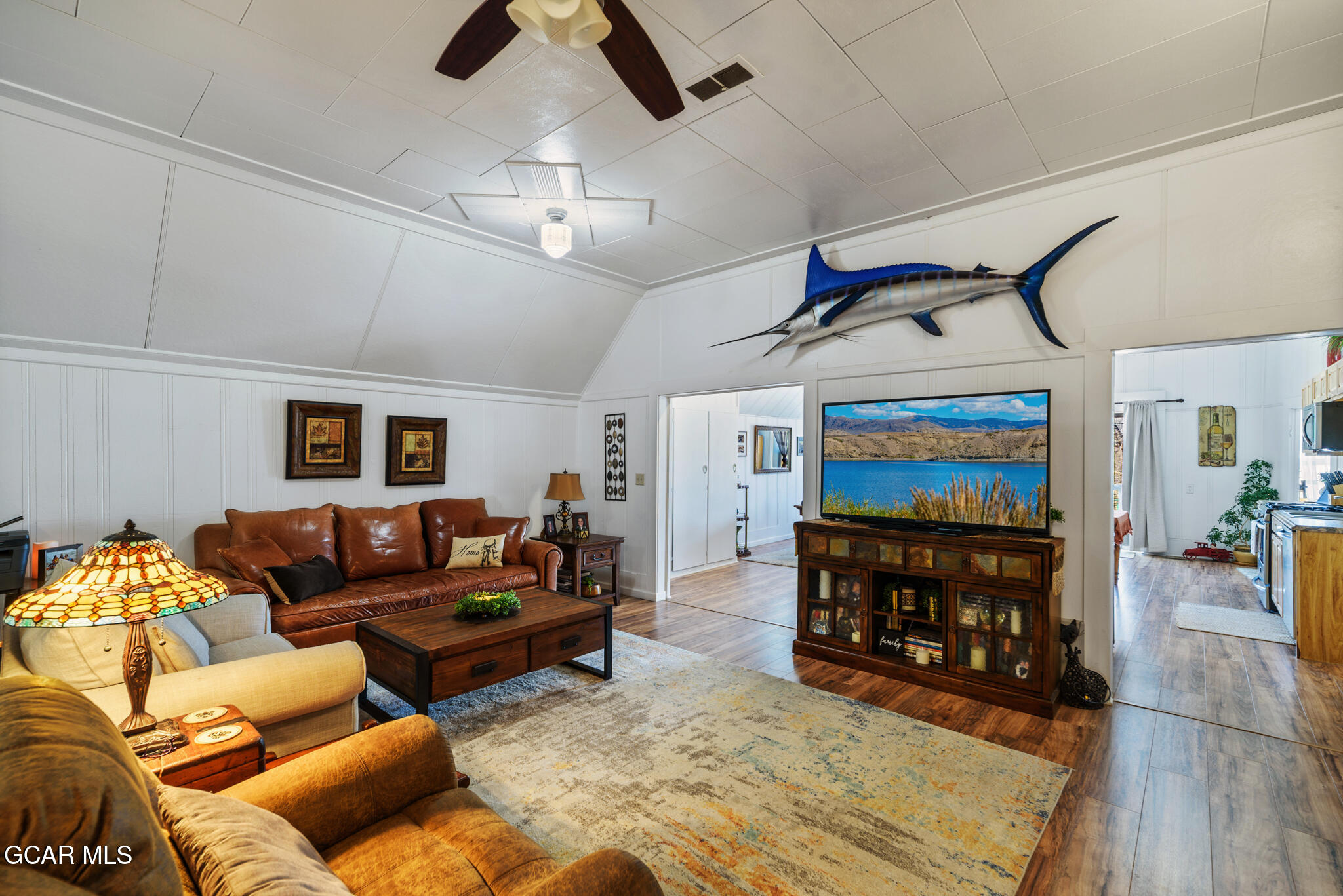 104 3rd Street Kremmling, CO 80459 - Photo 50 of 71 a living room with furniture and a flat screen tv
