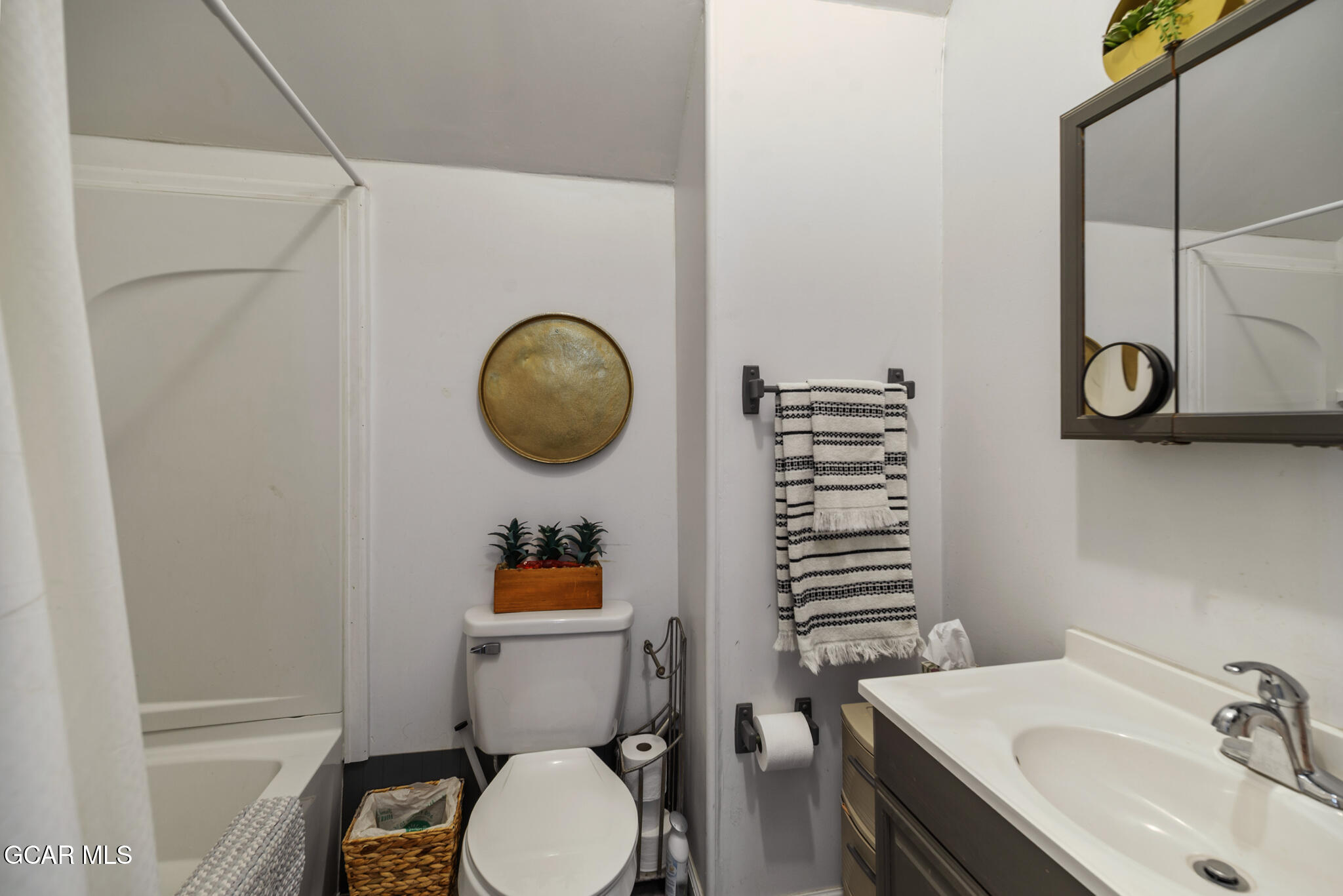 104 3rd Street Kremmling, CO 80459 - Photo 55 of 71 a bathroom with a sink a toilet and mirror