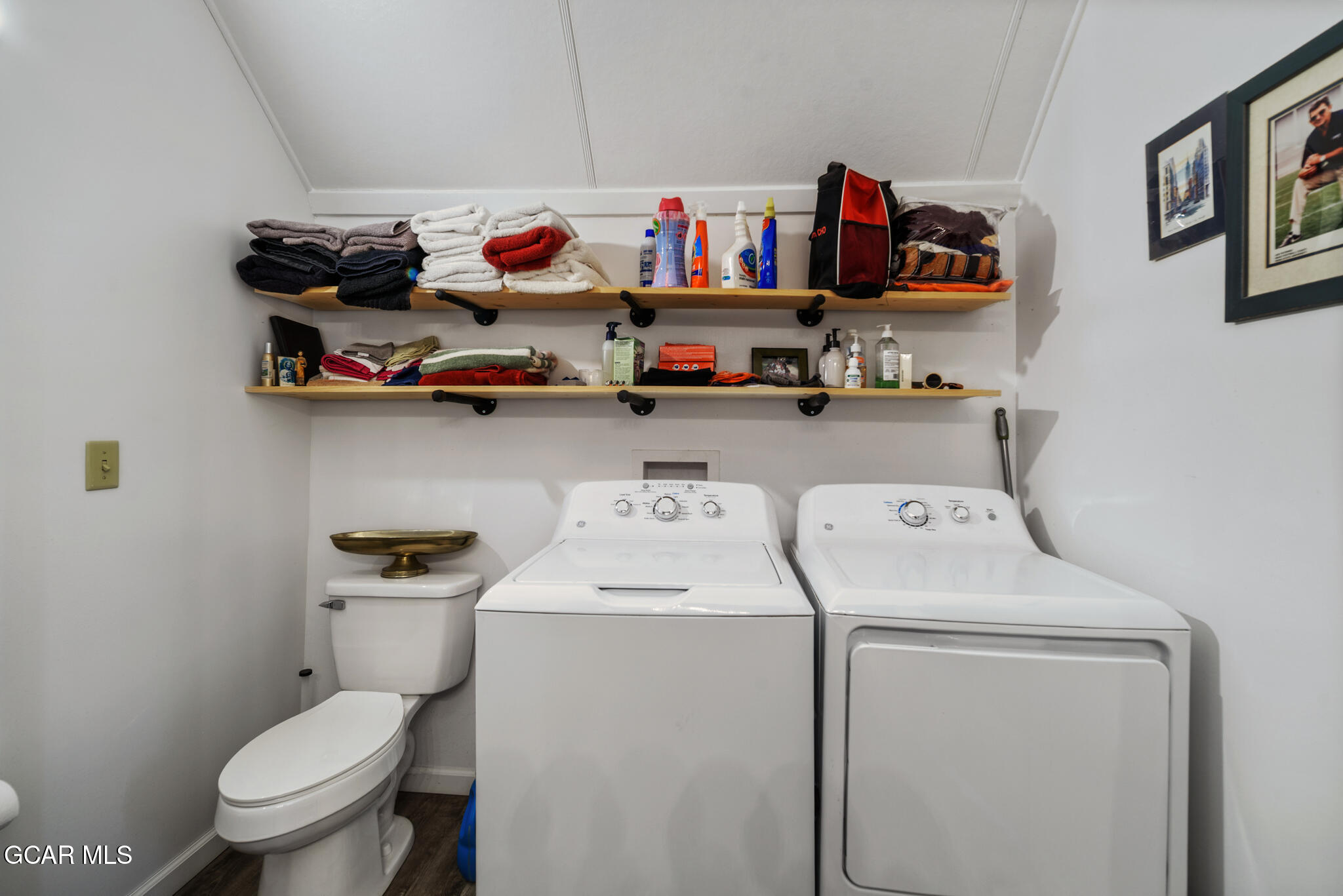 104 3rd Street Kremmling, CO 80459 - Photo 64 of 71 a utility room with dryer washer and shoe rack
