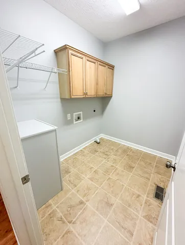 a view of a storage & utility room with a sink