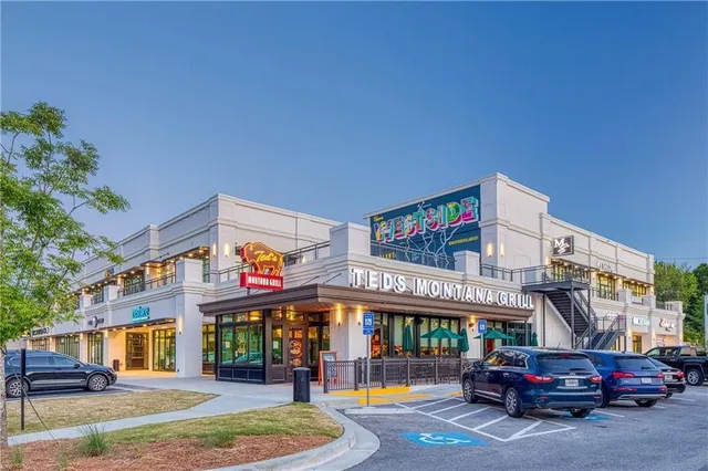 a sign that is sitting on a wooden floor