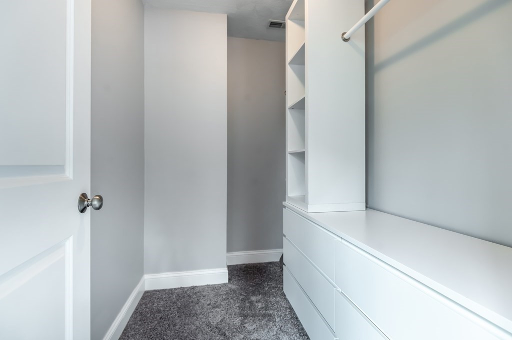 12 Bell Road Tewksbury, MA 01876 - Photo 18 of 26 a view of an empty walk in closet