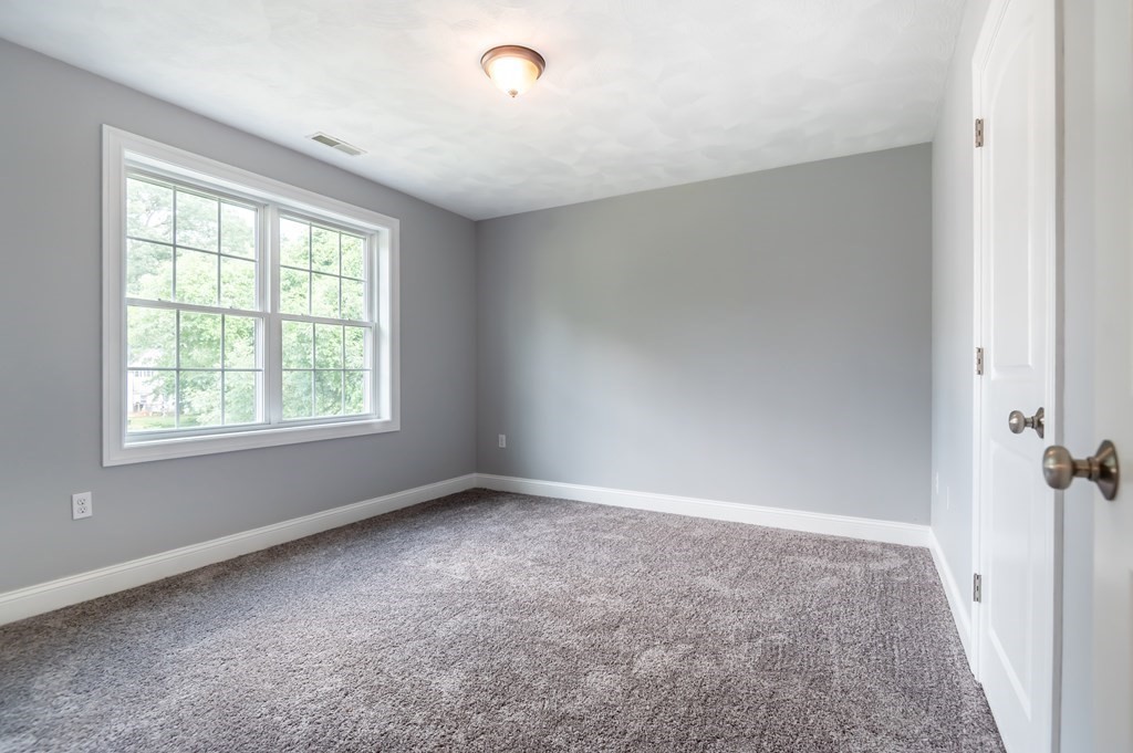 12 Bell Road Tewksbury, MA 01876 - Photo 20 of 26 wooden floor in an empty room with a window