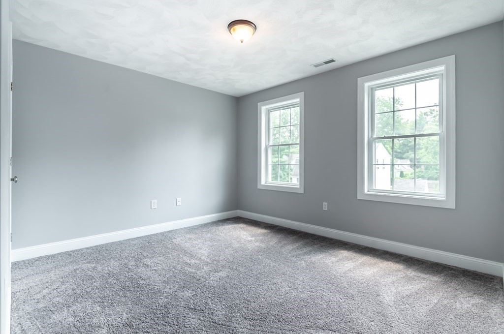 12 Bell Road Tewksbury, MA 01876 - Photo 21 of 26 an empty room with windows