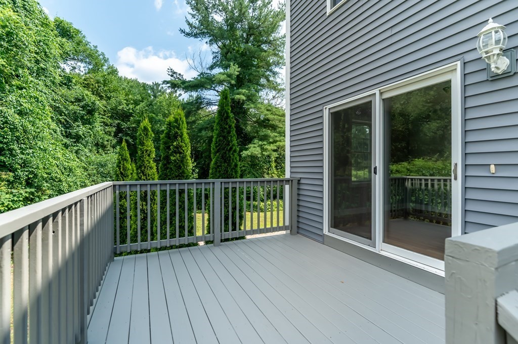 12 Bell Road Tewksbury, MA 01876 - Photo 4 of 26 a view of backyard with green space