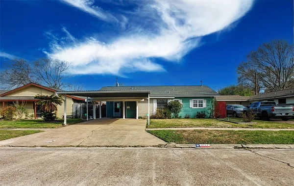 an aerial view of a house with outdoor space