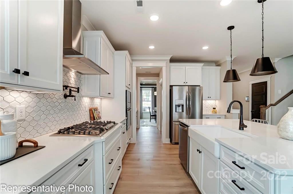 2345 Windley Drive Gastonia, NC 28054 - Photo 14 of 32 a kitchen with stainless steel appliances kitchen island a refrigerator and a sink