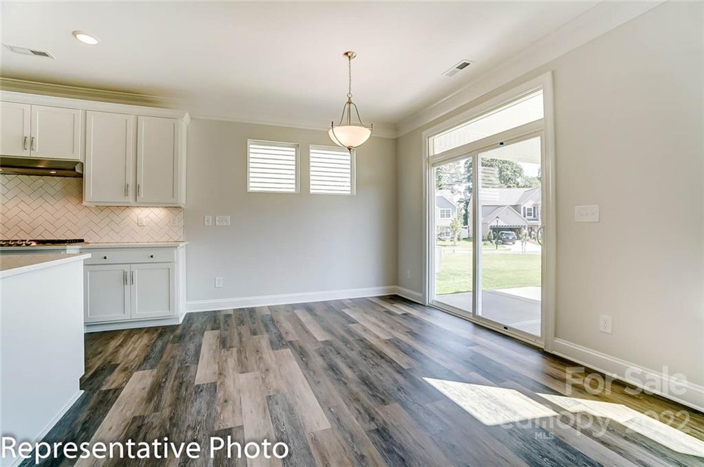 2345 Windley Drive Gastonia, NC 28054 - Photo 17 of 32 a view of kitchen with granite countertop window and wooden floor