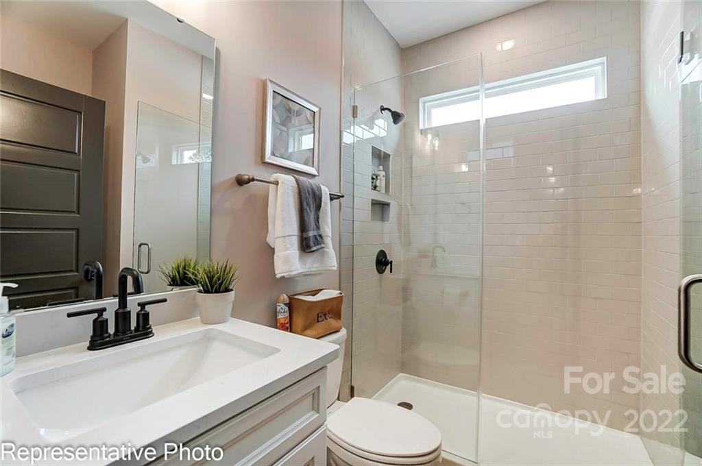 2345 Windley Drive Gastonia, NC 28054 - Photo 20 of 32 a bathroom with a sink a toilet and shower