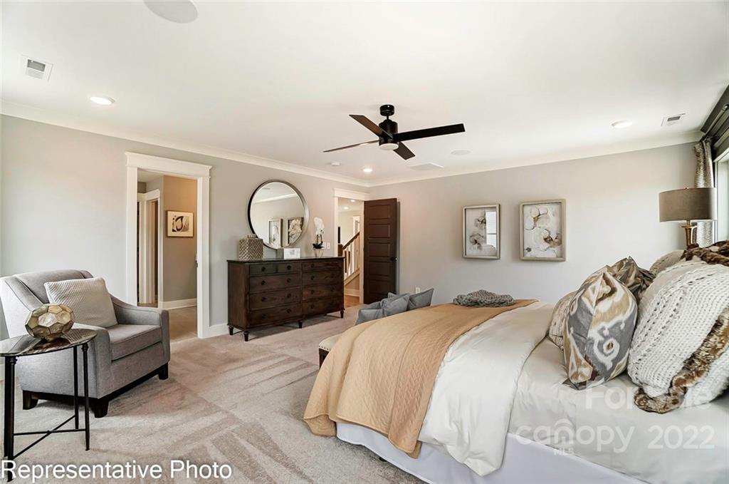 2345 Windley Drive Gastonia, NC 28054 - Photo 26 of 32 a bed room with a bed mirror and a desk