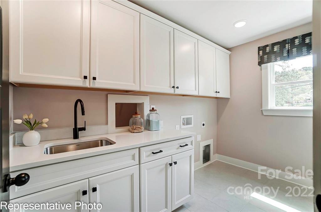 2345 Windley Drive Gastonia, NC 28054 - Photo 28 of 32 a kitchen with stainless steel appliances granite countertop white cabinets a sink and a window