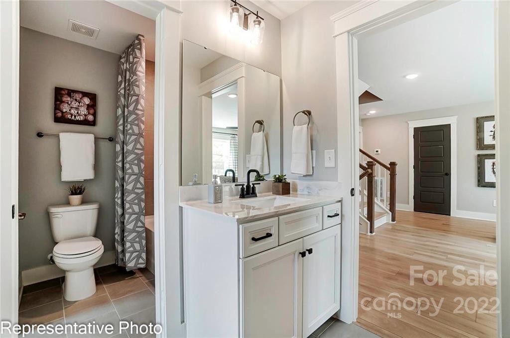 2345 Windley Drive Gastonia, NC 28054 - Photo 30 of 32 a spacious bathroom with a shower sink and toilet