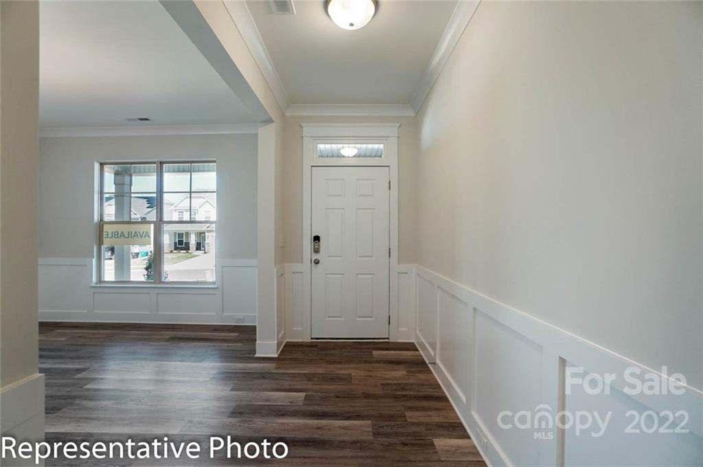 2345 Windley Drive Gastonia, NC 28054 - Photo 4 of 32 a view of an entryway with wooden floor