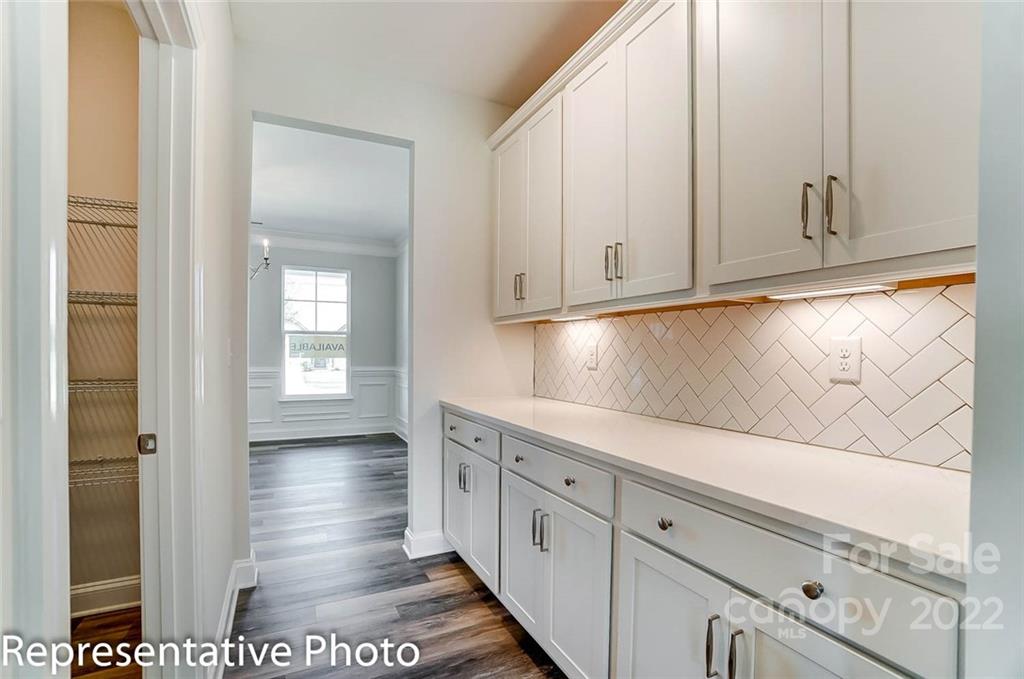 2345 Windley Drive Gastonia, NC 28054 - Photo 5 of 32 a kitchen with granite countertop white cabinets and sink