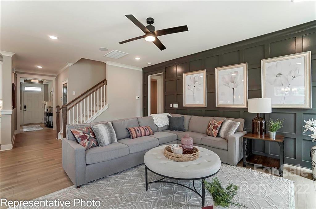 2345 Windley Drive Gastonia, NC 28054 - Photo 7 of 32 a living room with furniture and a wooden floor