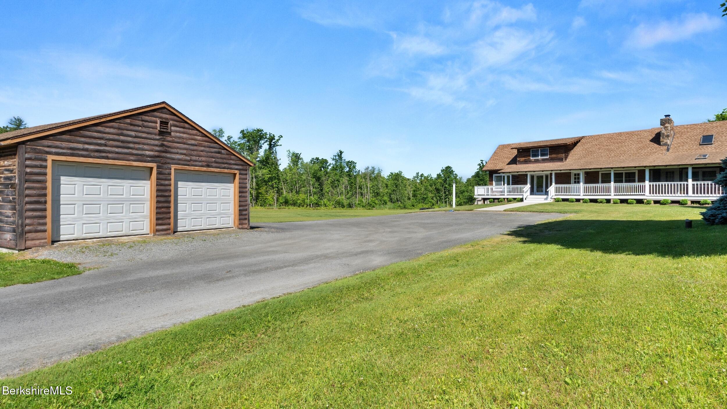 134 Hurlburt Road Great Barrington, MA 01230 - Photo 49 of 50 a front view of a house with a yard