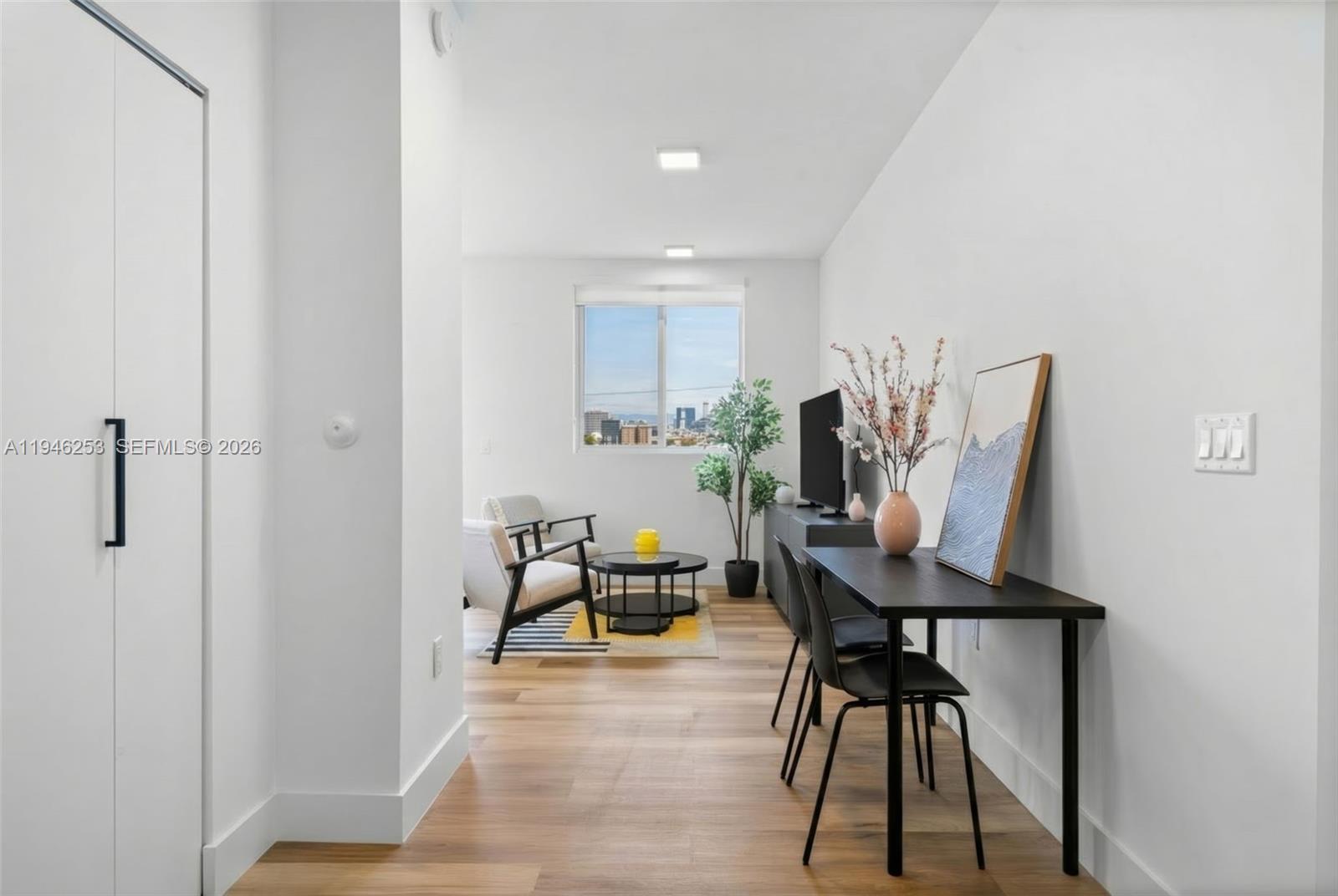 650 Southwest 1st Street, Unit 305 Miami, FL 33130 - Photo 11 of 28 a view of a room with furniture and wooden floor