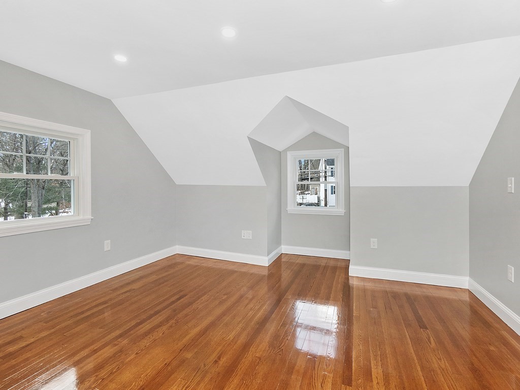46 Shawsheen Road Billerica, MA 01821 - Photo 10 of 18 an empty room with wooden floor and windows