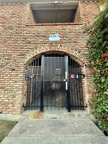a view of a wooden door of the house