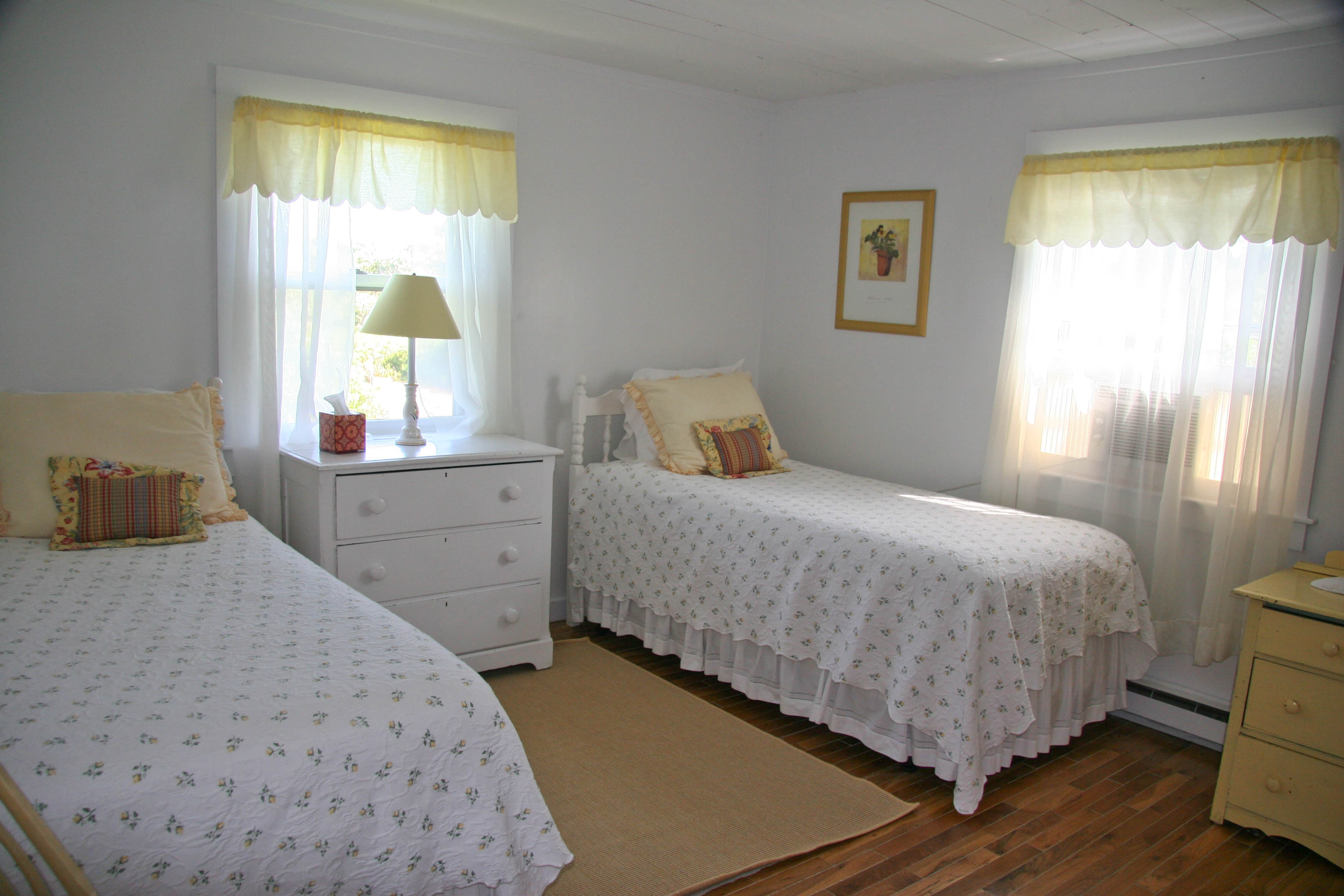 144 Surfside Road Nantucket, MA 02554 - Photo 44 of 46 a bedroom with a bed and window
